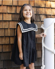 Load image into Gallery viewer, Black sailor dress by Rylee+Cru featuring classic collar and button details, shown on a model with a full view of the design.