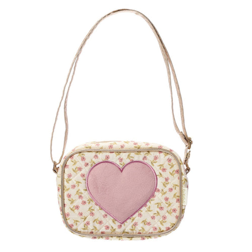 Small bag with a pink heart design on a floral patterned background
