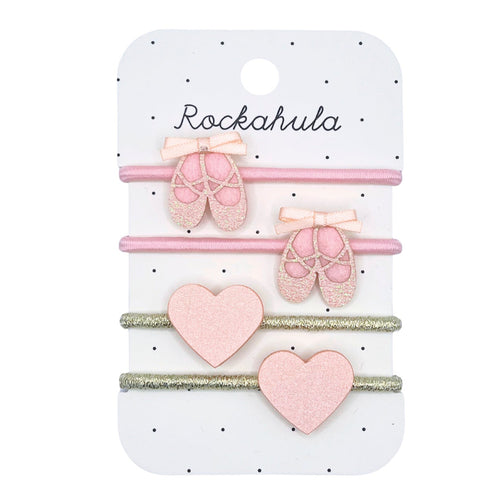 Set of pink hair accessories on a Rockahula branded card
