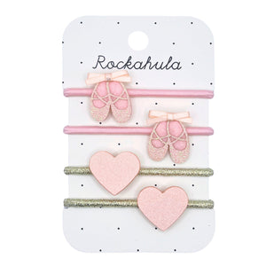 Set of pink hair accessories on a Rockahula branded card