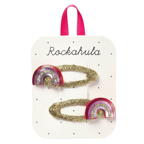Packaged hair accessories with rainbow design on a Rockahula branded card.
