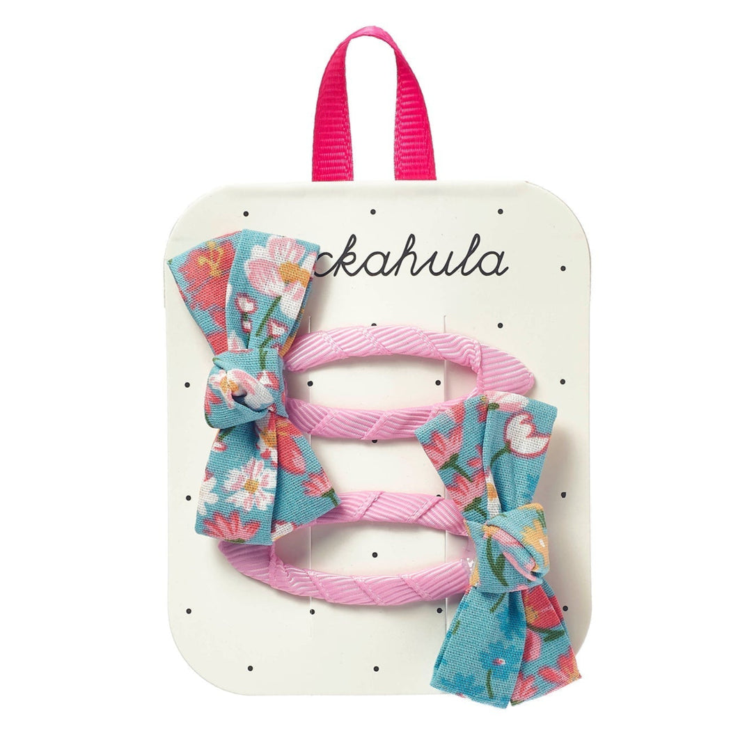 Set of hair accessories including bows and ribbons on a branded card with 'ckahula' branding.