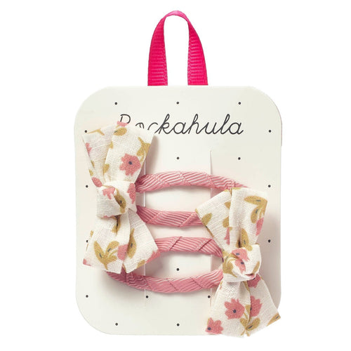 Set of hair ties with floral design on a branded card