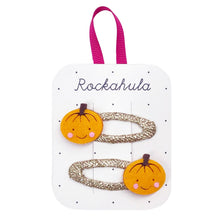 Load image into Gallery viewer, Set of hair clips with pumpkin designs on a Rockahula branded card.