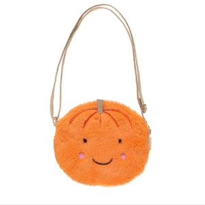 Orange plush bag with a smiley face on a white background