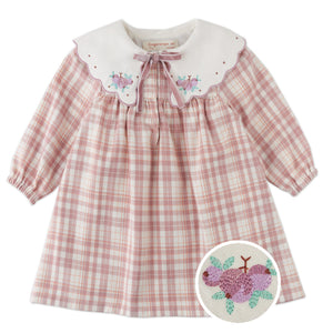 Pink checkered dress with embroidered collar and turtle design on a white background