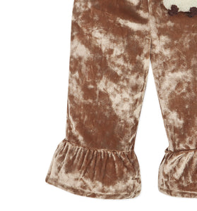 Brown velvet pants with ruffled hem on a white background