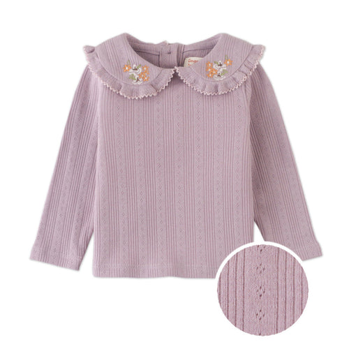 Pink ribbed sweater with embroidered collar on a white background