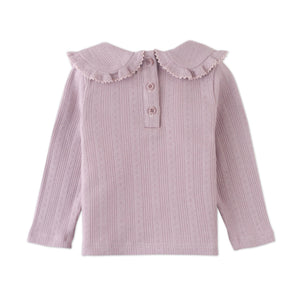 Pink ribbed blouse with ruffled collar on a white background