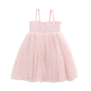 Pink dress with smocked bodice and tulle skirt on a white background