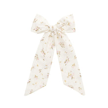 Load image into Gallery viewer, Floral scarf tied into a bow on a white background