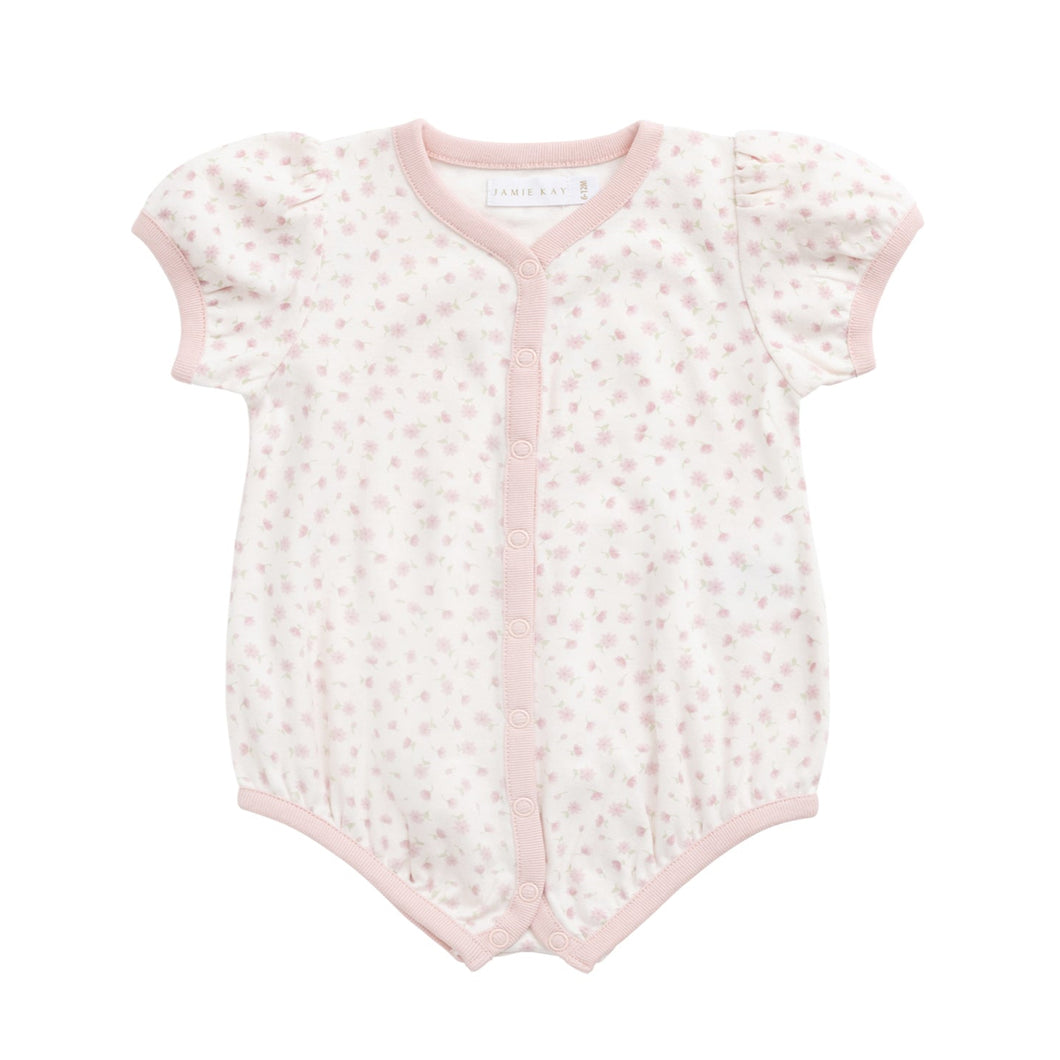 Baby romper with floral pattern on a white background