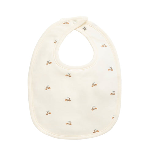 White bib with small gold patterns on a white background