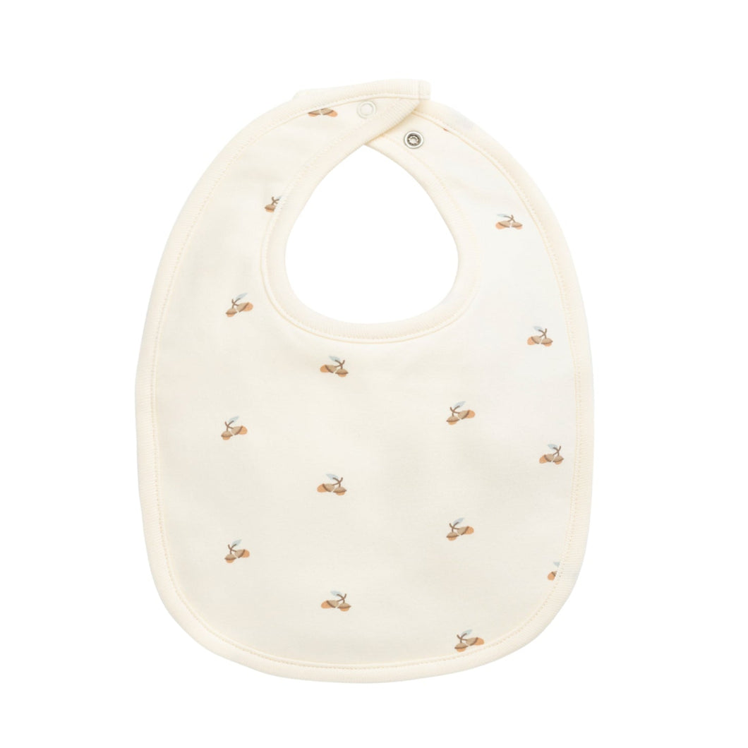 White bib with small gold patterns on a white background