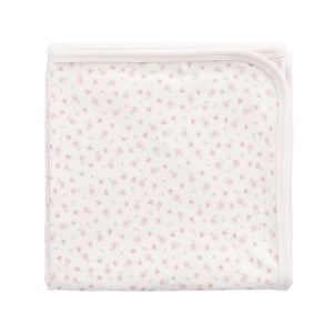 Small white pouch with a subtle pattern on a light beige background