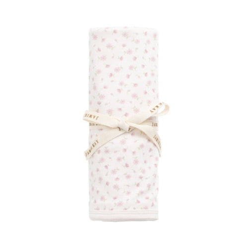 Folded fabric with a subtle pattern on a white background