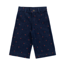 Load image into Gallery viewer, Navy shorts with small red patterns on a white background