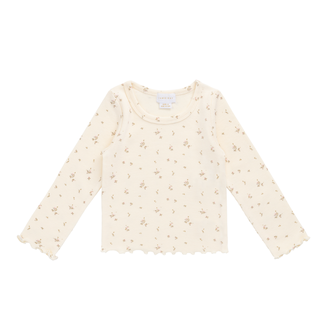 Beige long-sleeve shirt with subtle pattern on a white background