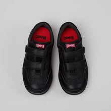將圖片載入圖庫檢視器 A pair of black Conifer toddler slip-on shoes with hook-and-loop straps, shown from a top-down view on a light gray background.