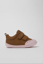 Load image into Gallery viewer, A toddler's brown shoe with two hook-and-loop straps and a light pink sole, shown from the side against a light gray background.