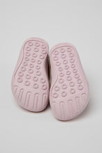 Load image into Gallery viewer, A pair of light pink ten-gum slip-on shoes shown from the sole view, featuring textured grip patterns and a five-toed design, set against a neutral light gray background.