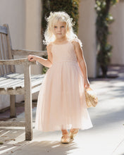 Load image into Gallery viewer, Noralee Camilla Dress Pearl in a stylish, elegant dress with pearl accents, shown in a lifestyle setting.