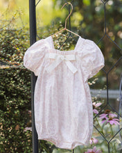 Load image into Gallery viewer, Noralee Lyla Lavender Floral Romper shown on a model, featuring a stylish summer romper with a floral pattern and relaxed fit.