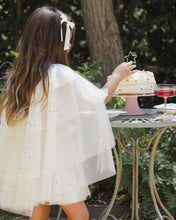 將圖片載入圖庫檢視器 Noralee Tulle Cape Confetti top shown in a lifestyle setting, featuring delicate tulle fabric with colorful confetti details.