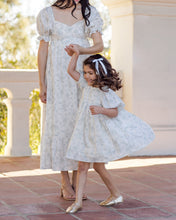 Load image into Gallery viewer, Ivory satin ribbon bow headband with pearl accents by Noralee, styled on a soft headband for a delicate, elegant look.
