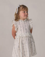 Load image into Gallery viewer, Ivory satin ribbon bow headband with pearl accents by Noralee, styled on a soft headband for elegant wear.