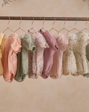 Load image into Gallery viewer, Noralee Maddie Romper in pastel garden print, lightweight fabric with floral pattern, displayed on a hanger against a neutral background.