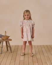 Load image into Gallery viewer, Noralee Maddie Dress in pastel garden print, showcasing a floral, sleeveless summer dress with a fitted bodice and flowing skirt.