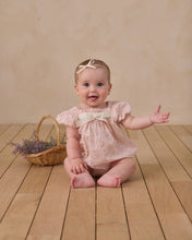 Load image into Gallery viewer, Noralee Lyla floral lavender romper displayed on a white background, showing the flowy fabric and floral pattern.
