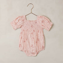 Load image into Gallery viewer, Noralee Hazel Romper in blush with a floral bouquet pattern, featuring a relaxed fit and short sleeves.