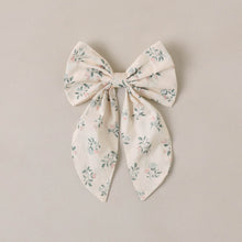 Load image into Gallery viewer, Floral-patterned bow on a beige background