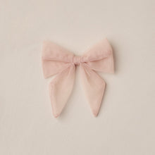 Load image into Gallery viewer, Pink bow on a beige background