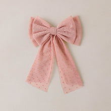 Load image into Gallery viewer, Pink bow on a beige background