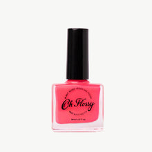 Load image into Gallery viewer, Pink nail polish bottle with black cap on a white background