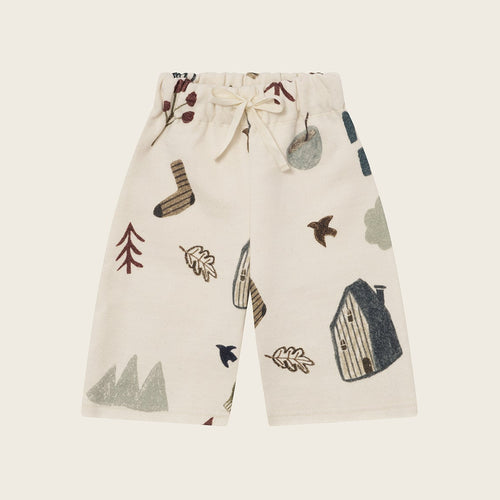 Children's shorts with nature-themed pattern on a white background
