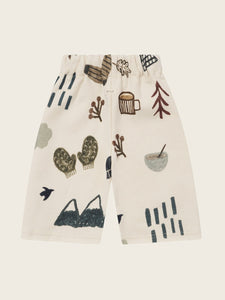 Pants with winter-themed pattern on a light background
