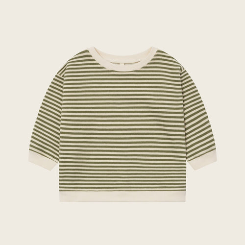 Striped shirt with green and white horizontal stripes on a beige background