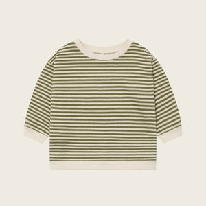 Striped shirt with green and white horizontal stripes on a beige background