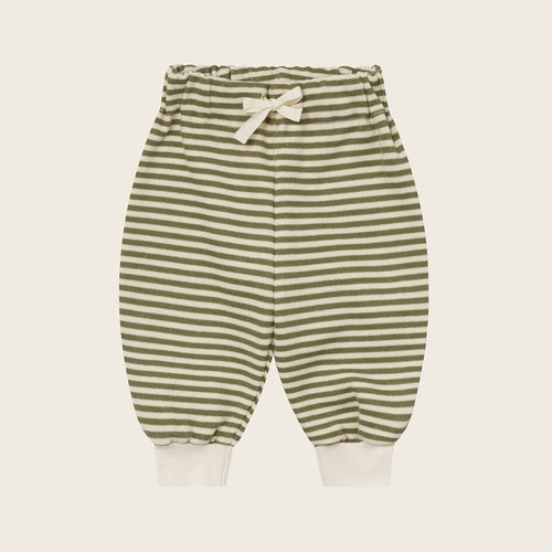 Striped baby pants on a light beige background
