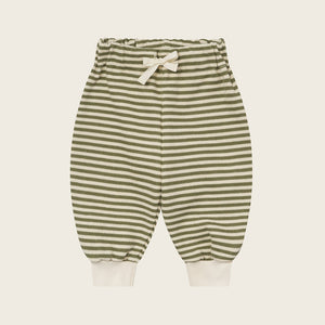 Striped baby pants on a light beige background