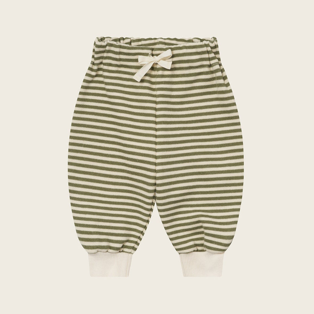 Striped baby pants on a light beige background