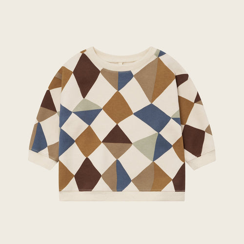 Sweater with geometric pattern on a beige background