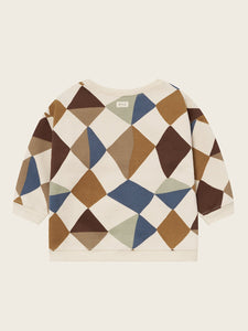 Sweater with geometric pattern on a beige background