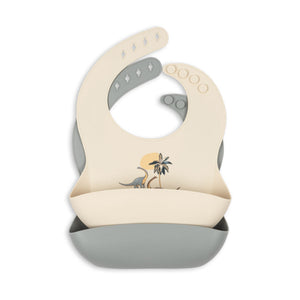 Baby bib with dinosaur design on a white background