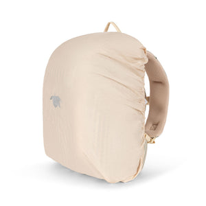Beige backpack with a compression sack on a white background