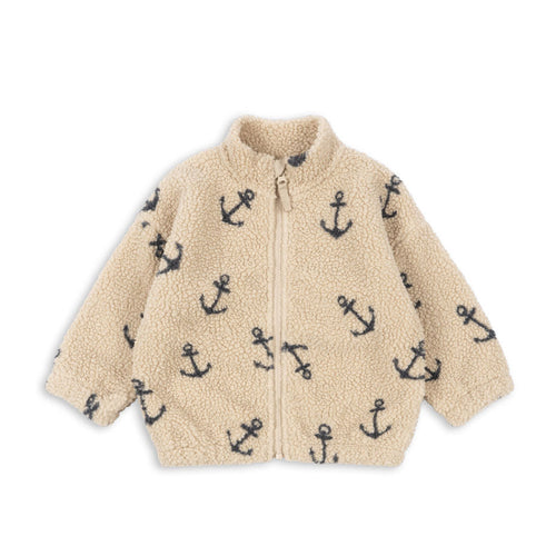 Beige fleece jacket with anchor pattern on a white background